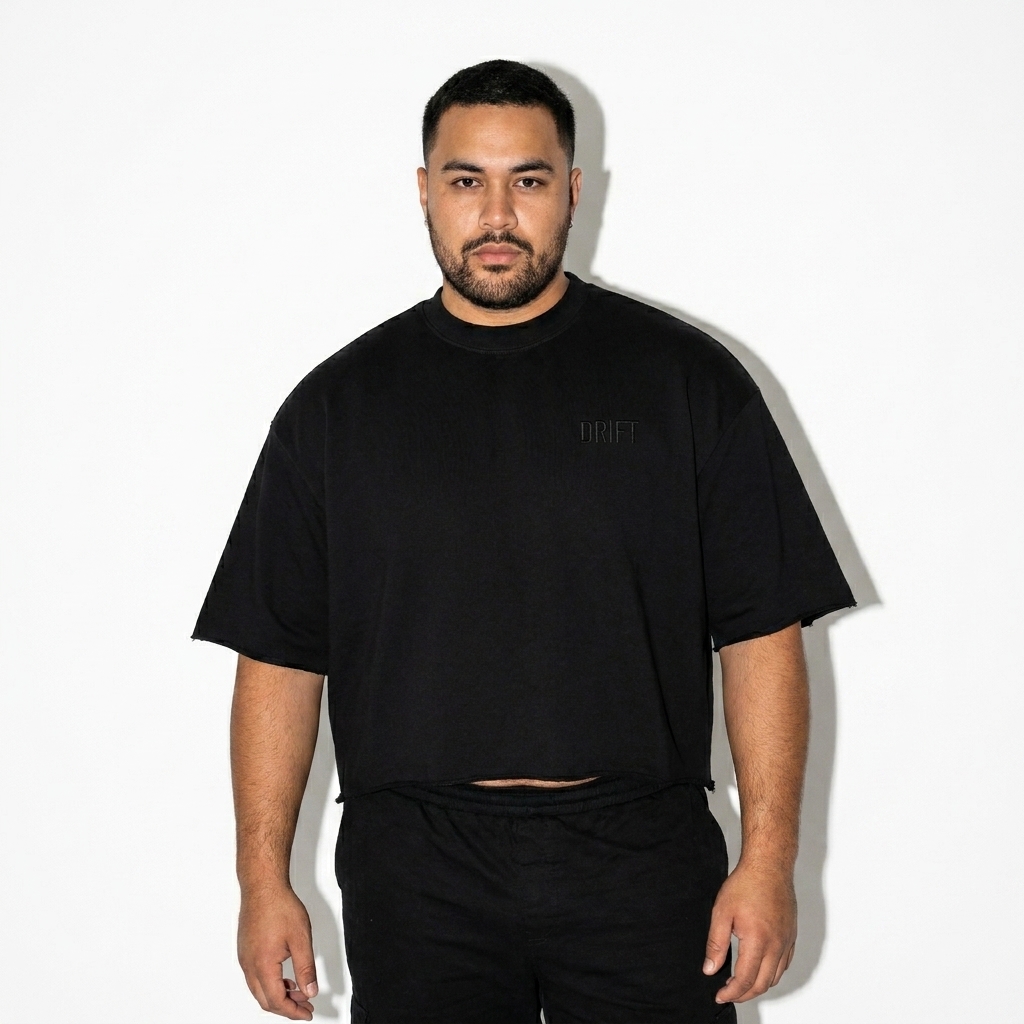 French Terry Raw Edge T-Shirt worn by a curvy Australian male fashion influencer, y2k revival styling, studio lookbook — custom french terry raw edge t-shirt