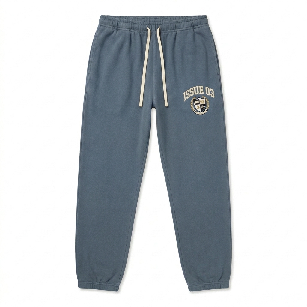 Custom Garment-Dyed Fleece Sweatpants design direction 3: Retro Collegiate Emblem featuring the ISSUE 03 wordmark