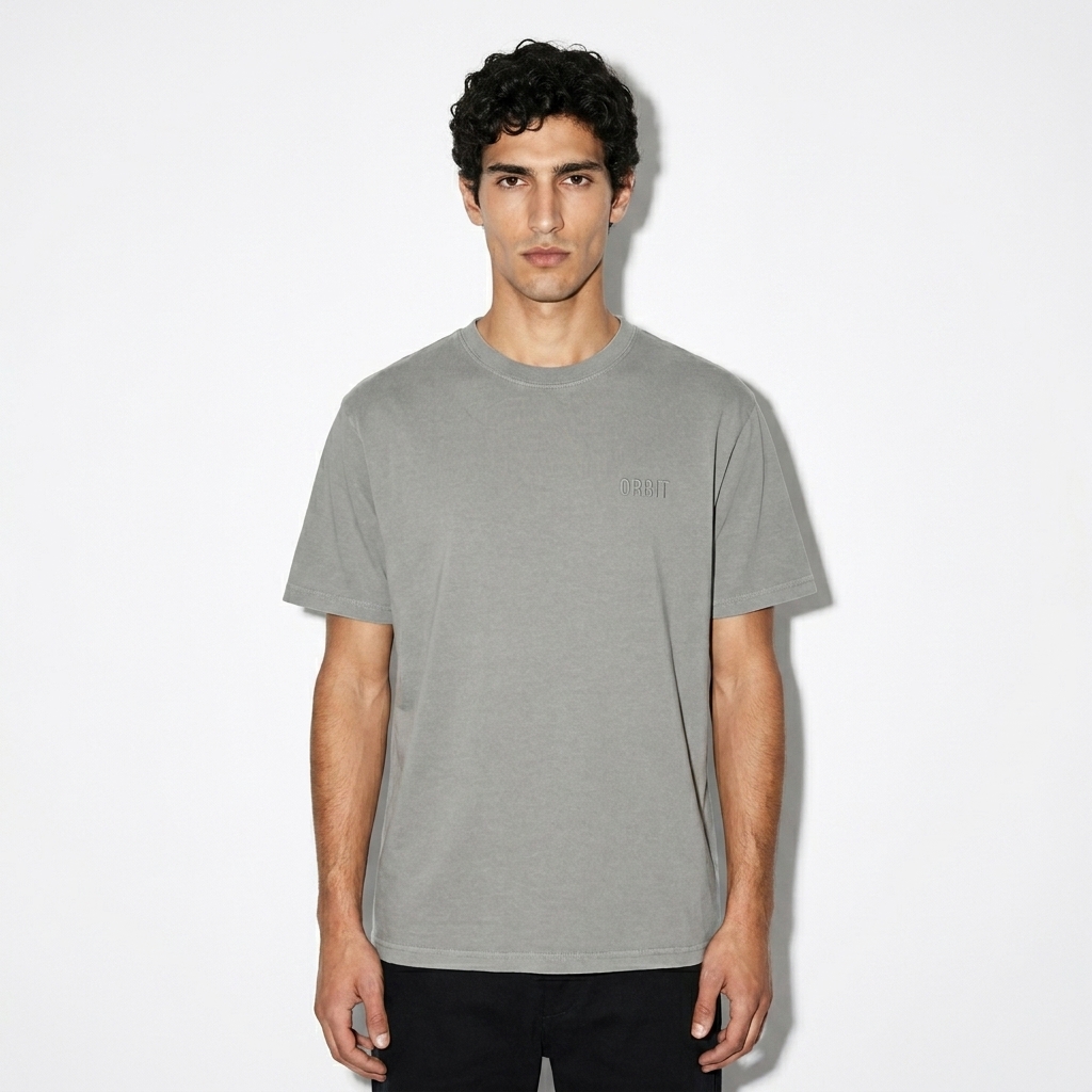 Garment Dyed Vintage T-Shirt worn by a slim tall Mediterranean male fashion influencer, workwear utility styling, studio lookbook — custom garment dyed vintage t-shirt