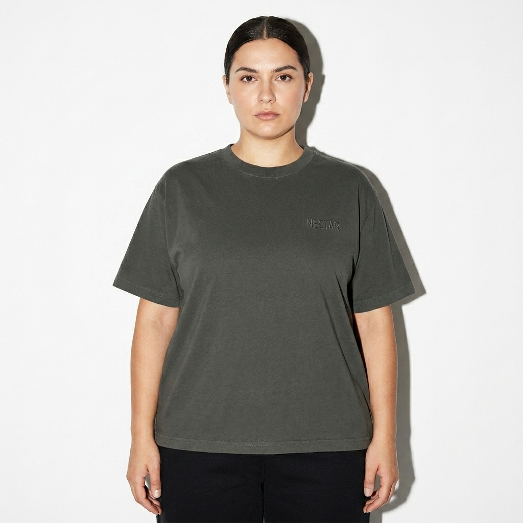 Heavyweight Boxy T-Shirt worn by a mid-size Eastern European female fashion influencer, sporty athleisure styling, studio lookbook — custom heavyweight boxy t-shirt