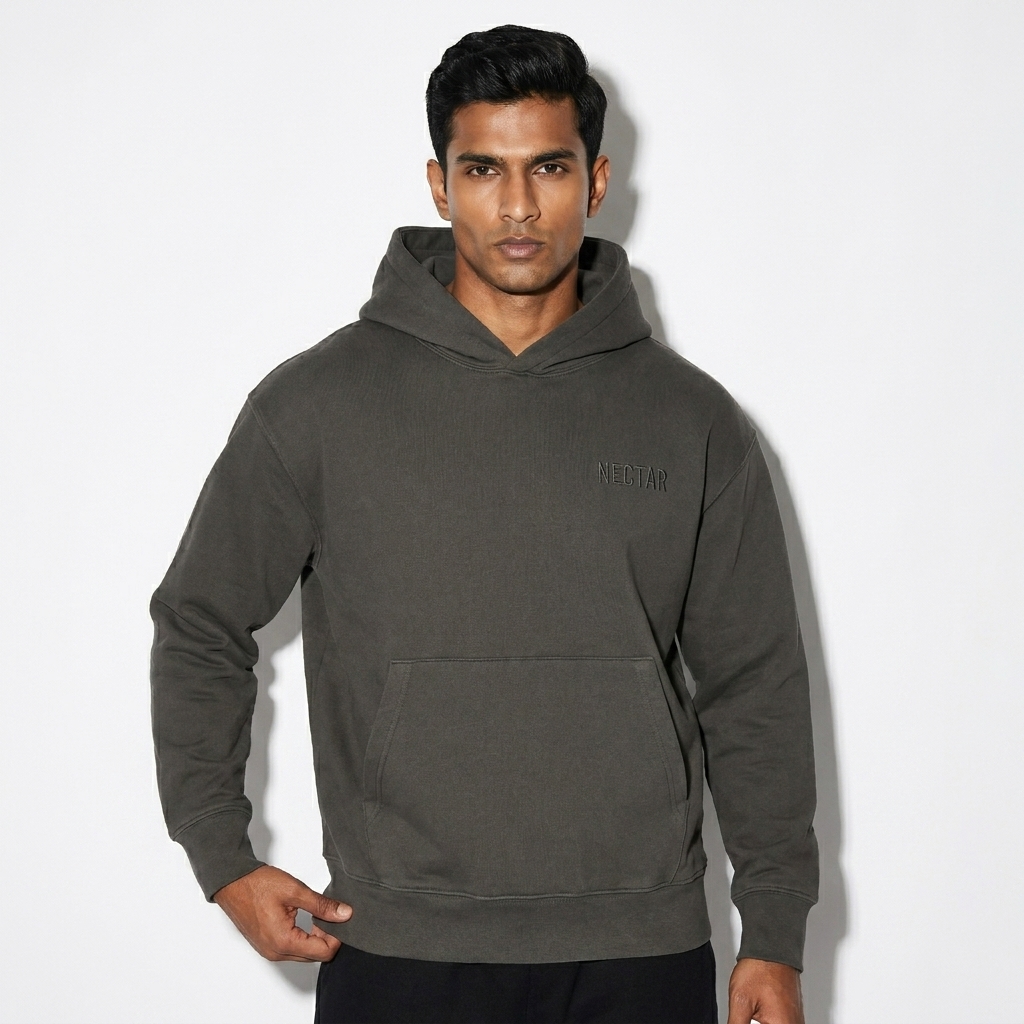 Heavyweight Cotton Pullover Hoodie worn by a toned Indian male fashion influencer, editorial avant-garde styling, studio lookbook — custom heavyweight cotton pullover hoodie