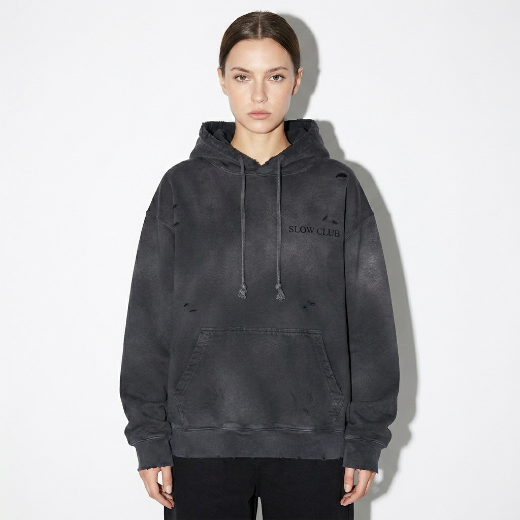 Heavyweight Distressed Pullover Hoodie worn by a petite White European female fashion influencer, workwear utility styling, studio lookbook — custom heavyweight distressed pullover hoodie