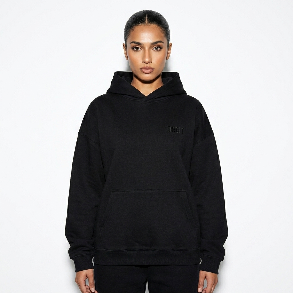 Heavyweight Drop-Shoulder Hoodie worn by a toned Pakistani female fashion influencer, y2k revival styling, studio lookbook — custom heavyweight drop-shoulder hoodie