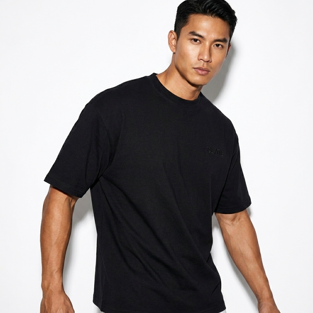 Heavyweight Drop Shoulder T-Shirt worn by a toned Vietnamese male fashion influencer, workwear utility styling, studio lookbook — custom heavyweight drop shoulder t-shirt