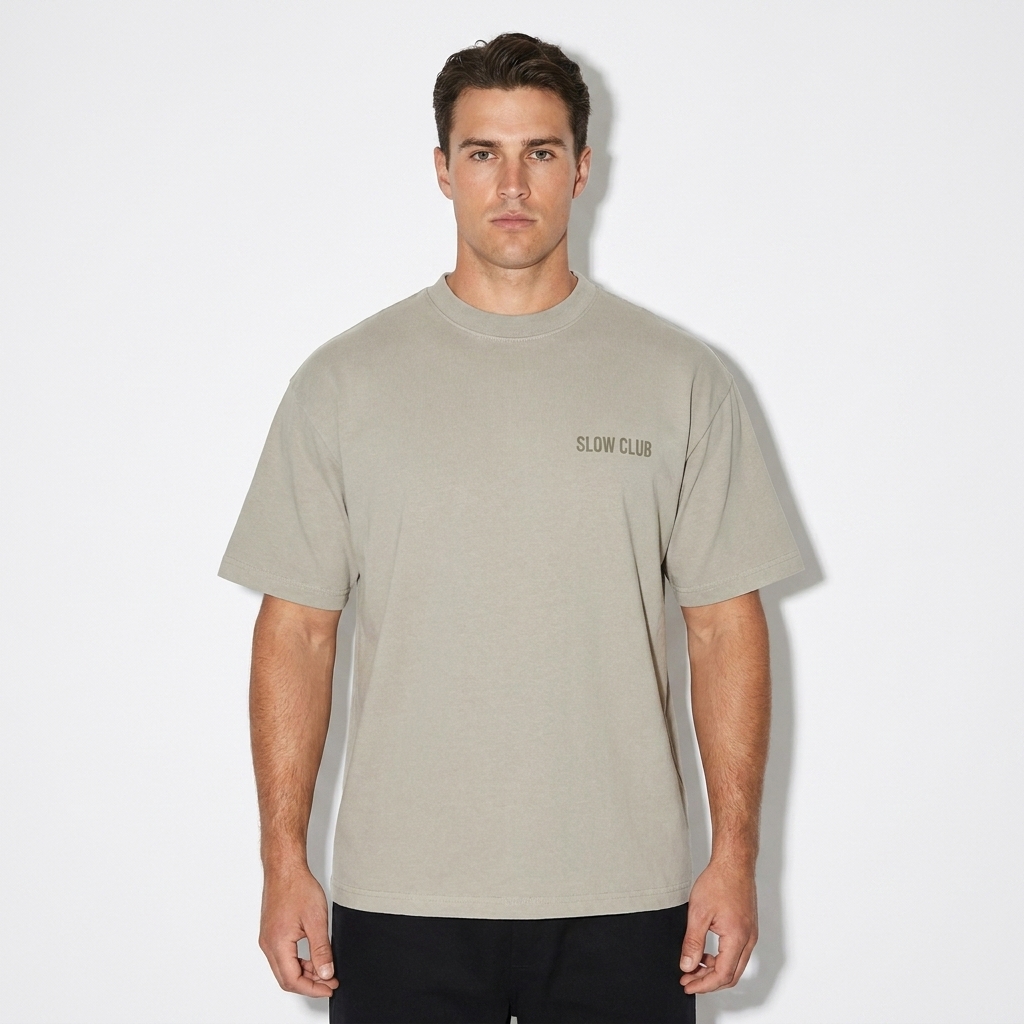 Heavyweight Earth Tone T-Shirt worn by a broad-shouldered Australian male fashion influencer, sporty athleisure styling, studio lookbook — custom heavyweight earth tone t-shirt