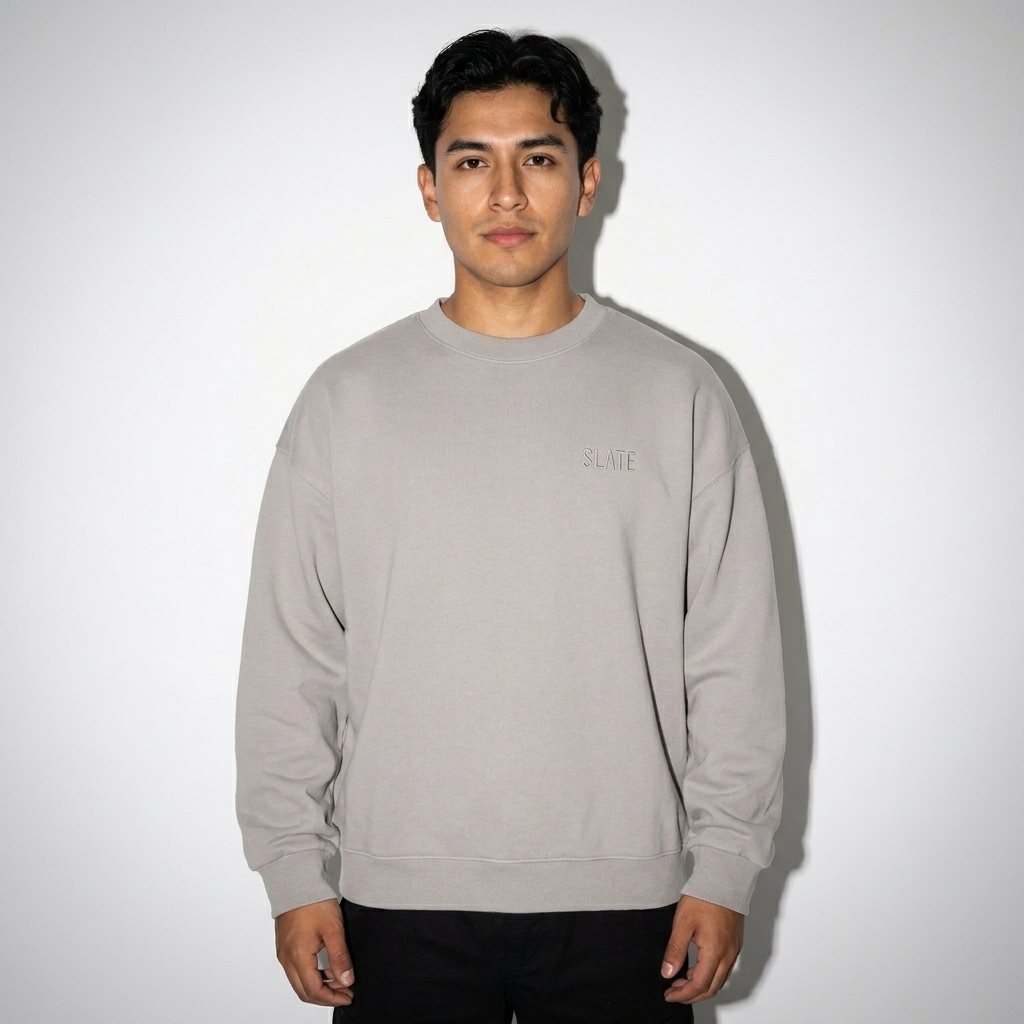 Heavyweight Essential Crewneck Sweatshirt worn by a petite Mexican male fashion influencer, minimalist luxury styling, studio lookbook — custom heavyweight essential crewneck sweatshirt