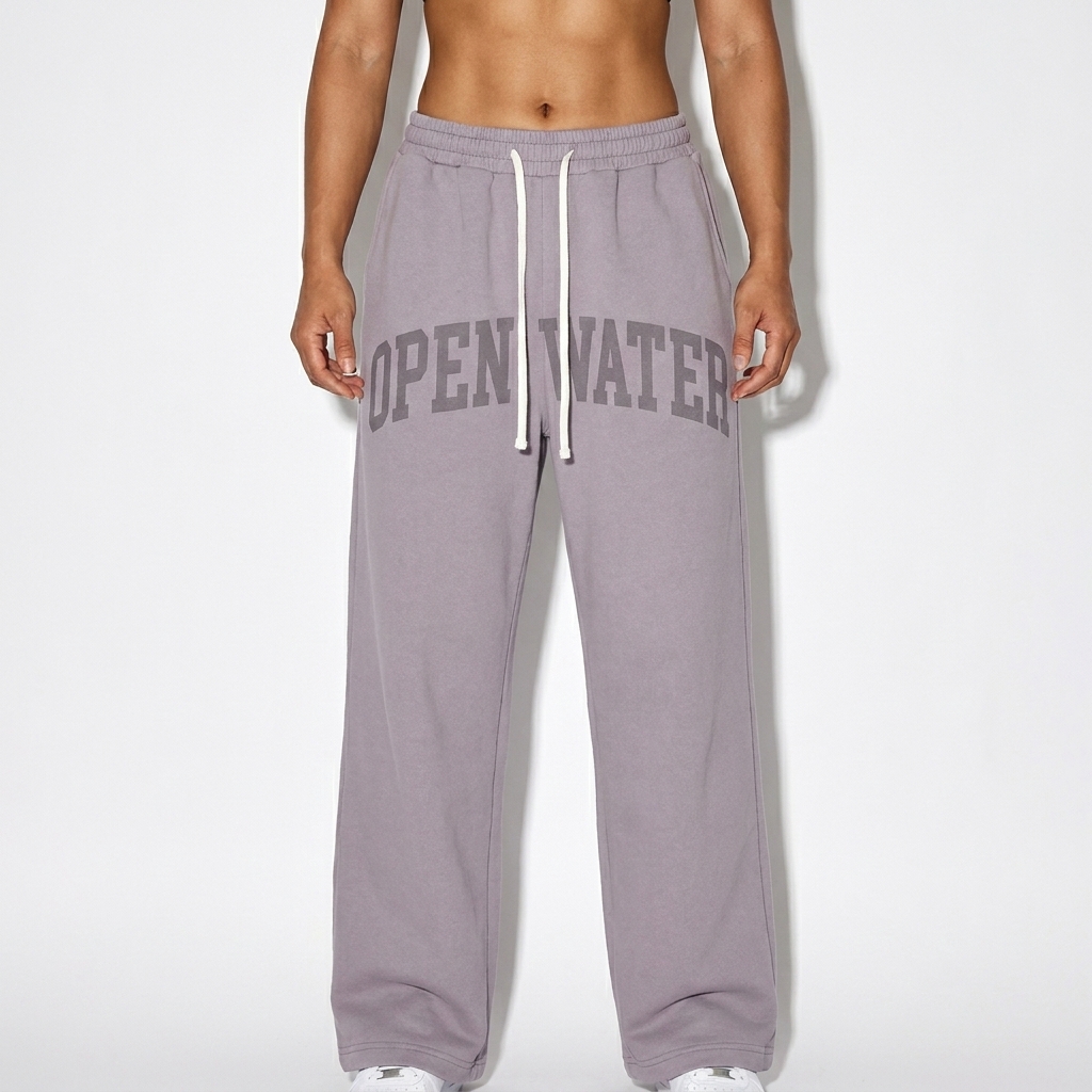 Heavyweight Fleece Sweatpants worn by a athletic muscular Vietnamese female fashion influencer, minimalist luxury styling, studio lookbook — custom heavyweight fleece sweatpants