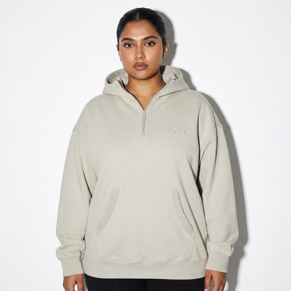 Heavyweight Half-Zip Fleece Hoodie worn by a curvy Indian female fashion influencer, minimalist luxury styling, studio lookbook — custom heavyweight half-zip fleece hoodie