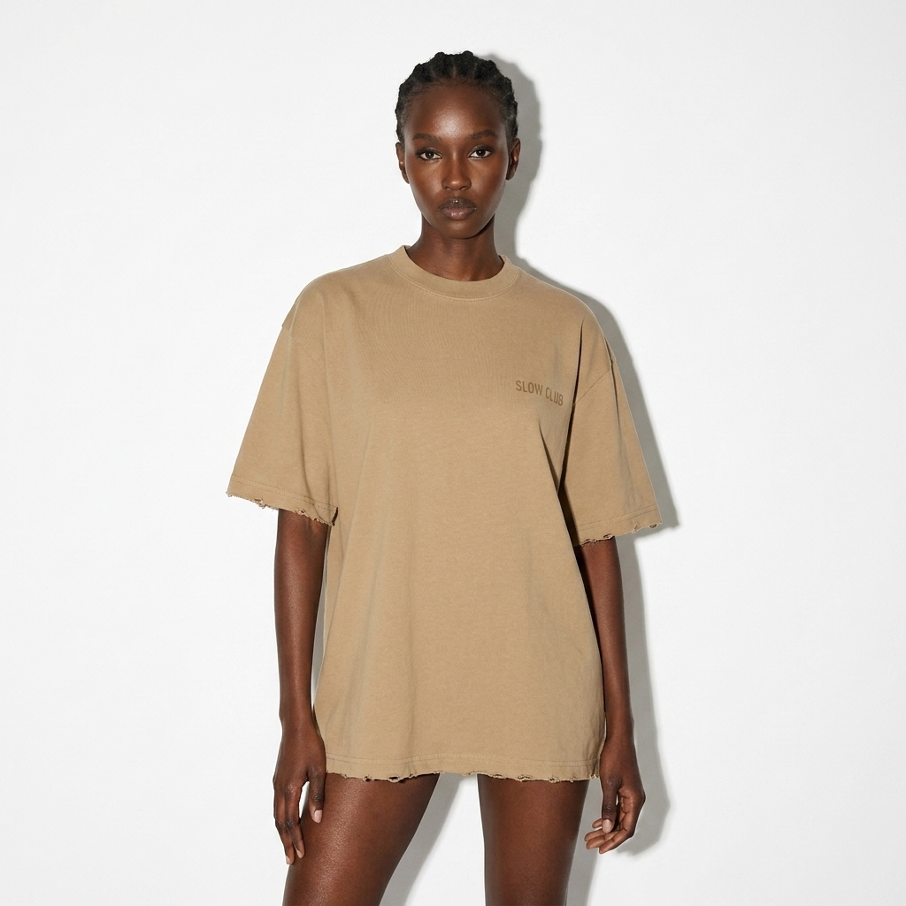 Heavyweight Hand-Frayed T-Shirt worn by a lean East African female fashion influencer, preppy ivy styling, studio lookbook — custom heavyweight hand-frayed t-shirt