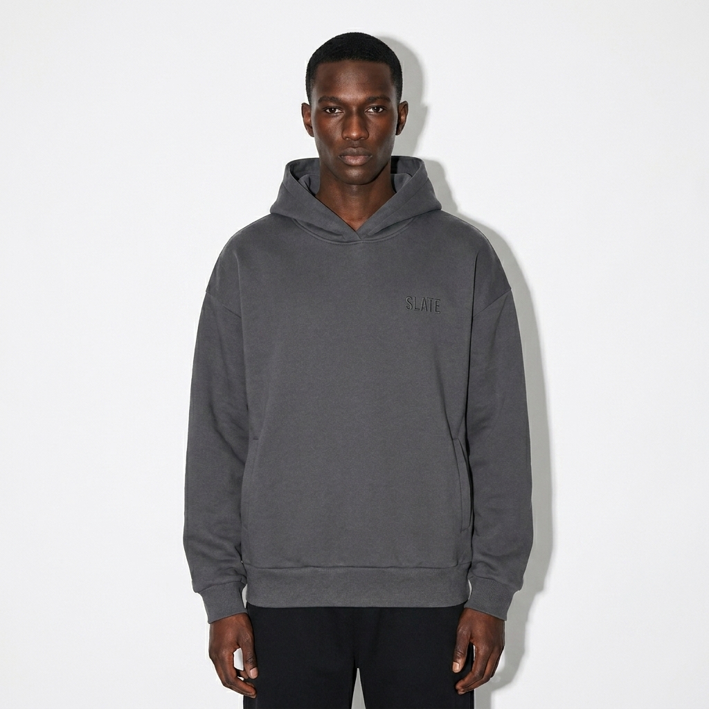 Heavyweight Hidden Pocket Hoodie worn by a slim tall African American male fashion influencer, editorial avant-garde styling, studio lookbook — custom heavyweight hidden pocket hoodie