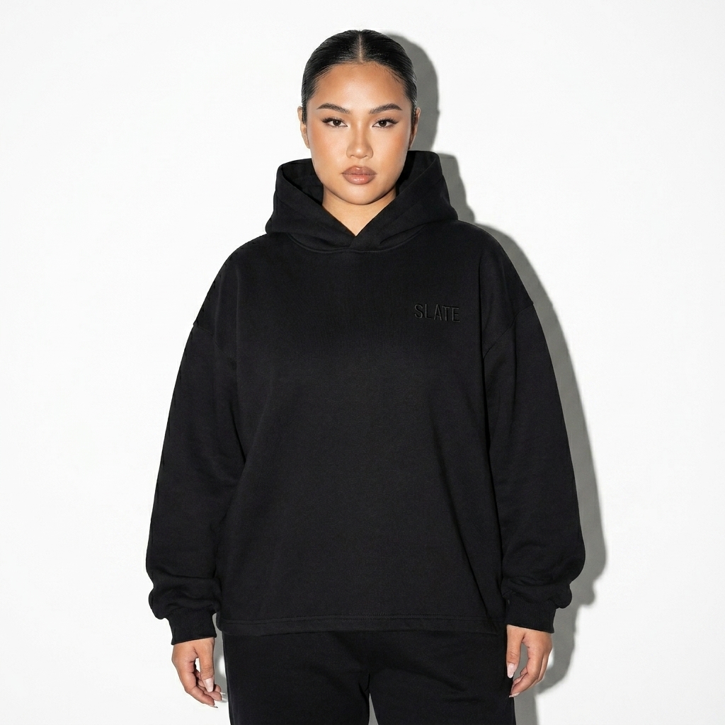 Heavyweight Oversized Drawstring Hem Hoodie worn by a curvy Vietnamese female fashion influencer, gorpcore outdoor styling, studio lookbook — custom heavyweight oversized drawstring hem hoodie