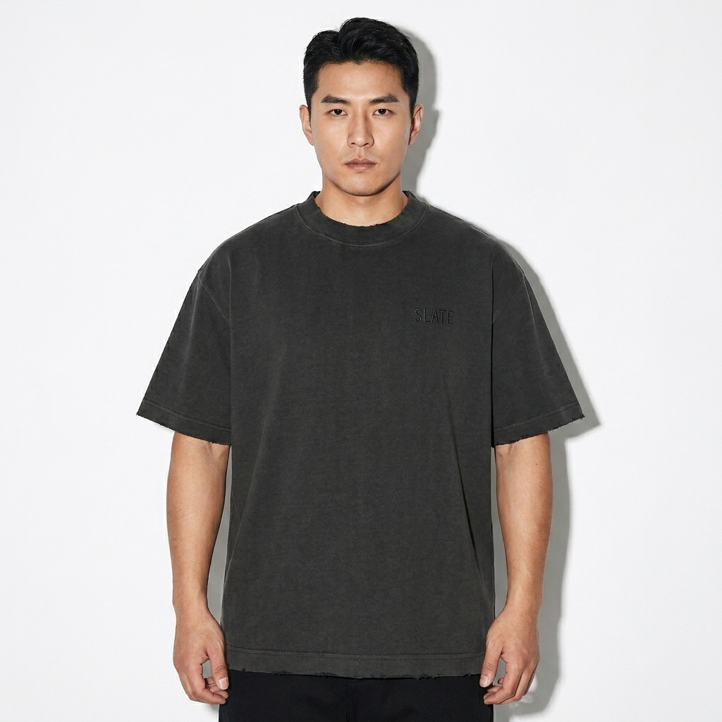 Heavyweight Vintage Washed T-Shirt worn by a mid-size Chinese male fashion influencer, editorial avant-garde styling, studio lookbook — custom heavyweight vintage washed t-shirt