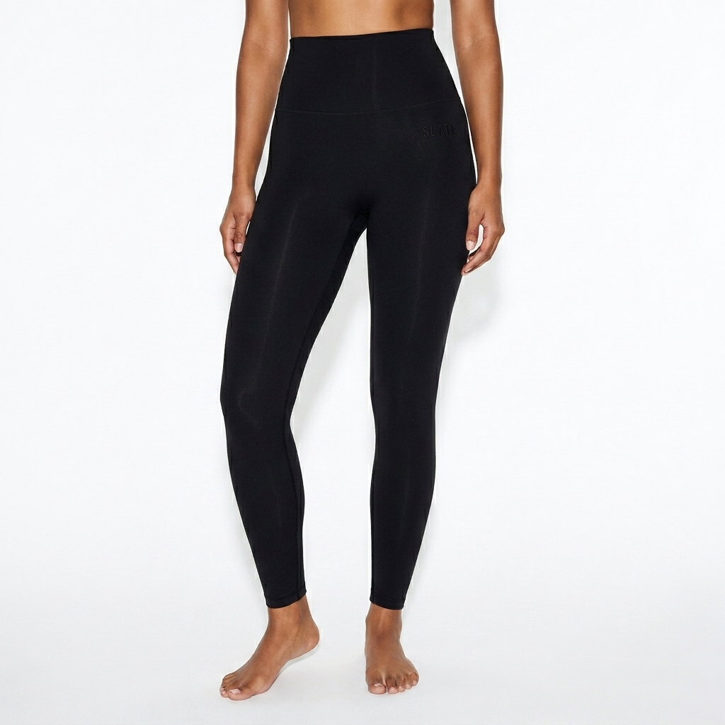 High-Waisted Yoga Leggings worn by a broad-shouldered South Asian female fashion influencer, sporty athleisure styling, studio lookbook — custom high-waisted yoga leggings