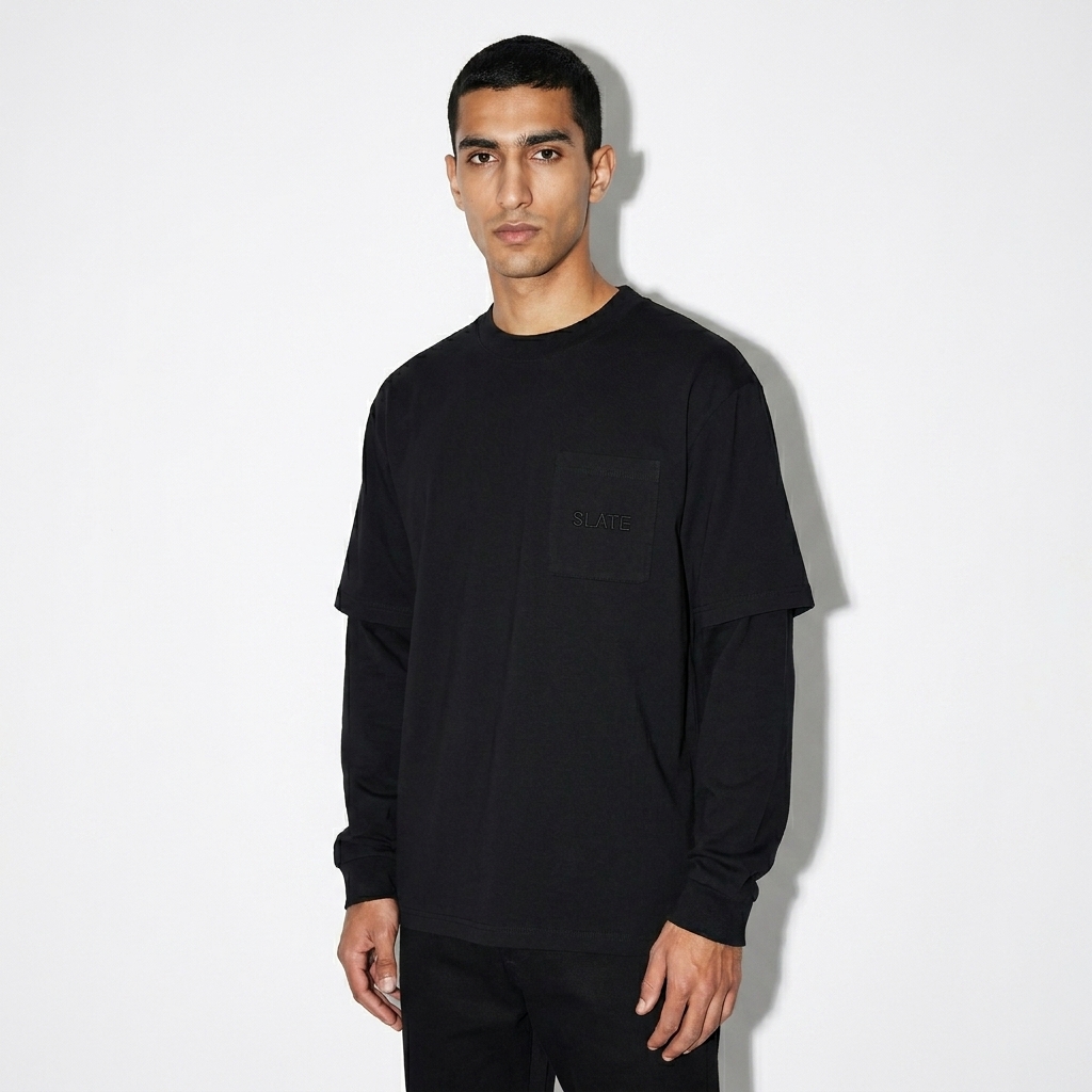 Layered Long Sleeve Oversized Tee worn by a slim tall Middle Eastern male fashion influencer, sporty athleisure styling, studio lookbook — custom layered long sleeve oversized tee