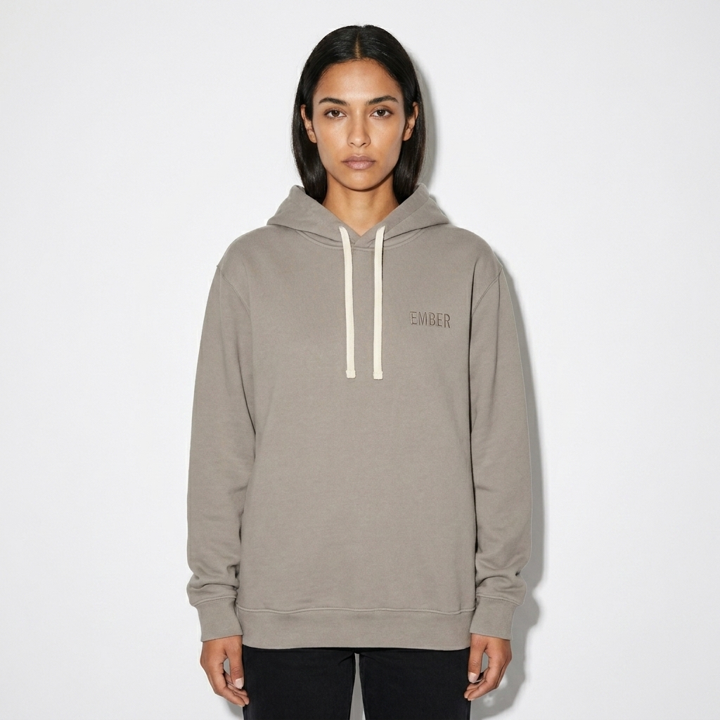 Unisex Garment-Dyed Lightweight Hoodie worn by a lean Hispanic female fashion influencer, techwear modern styling, studio lookbook — custom unisex garment-dyed lightweight hoodie