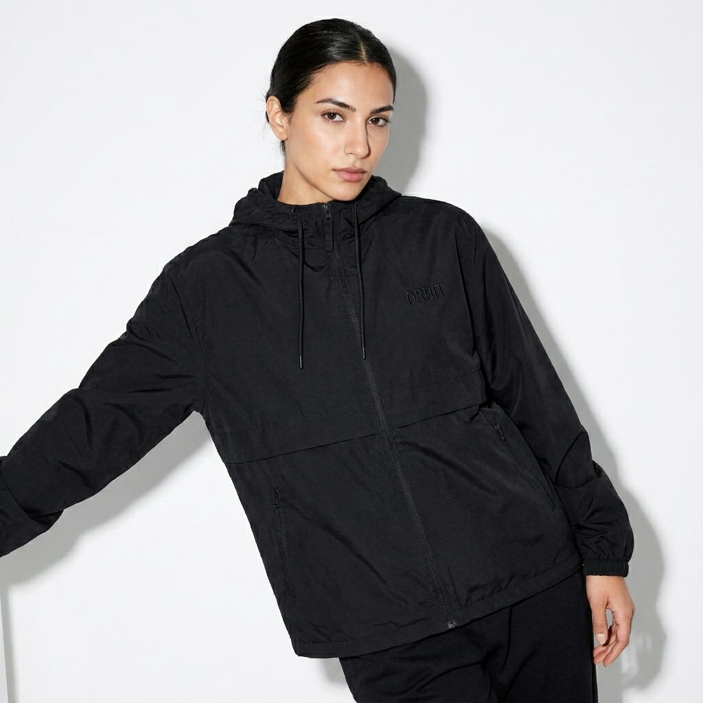 Lightweight Unisex Windbreaker worn by a lean Turkish female fashion influencer, sporty athleisure styling, studio lookbook — custom lightweight unisex windbreaker
