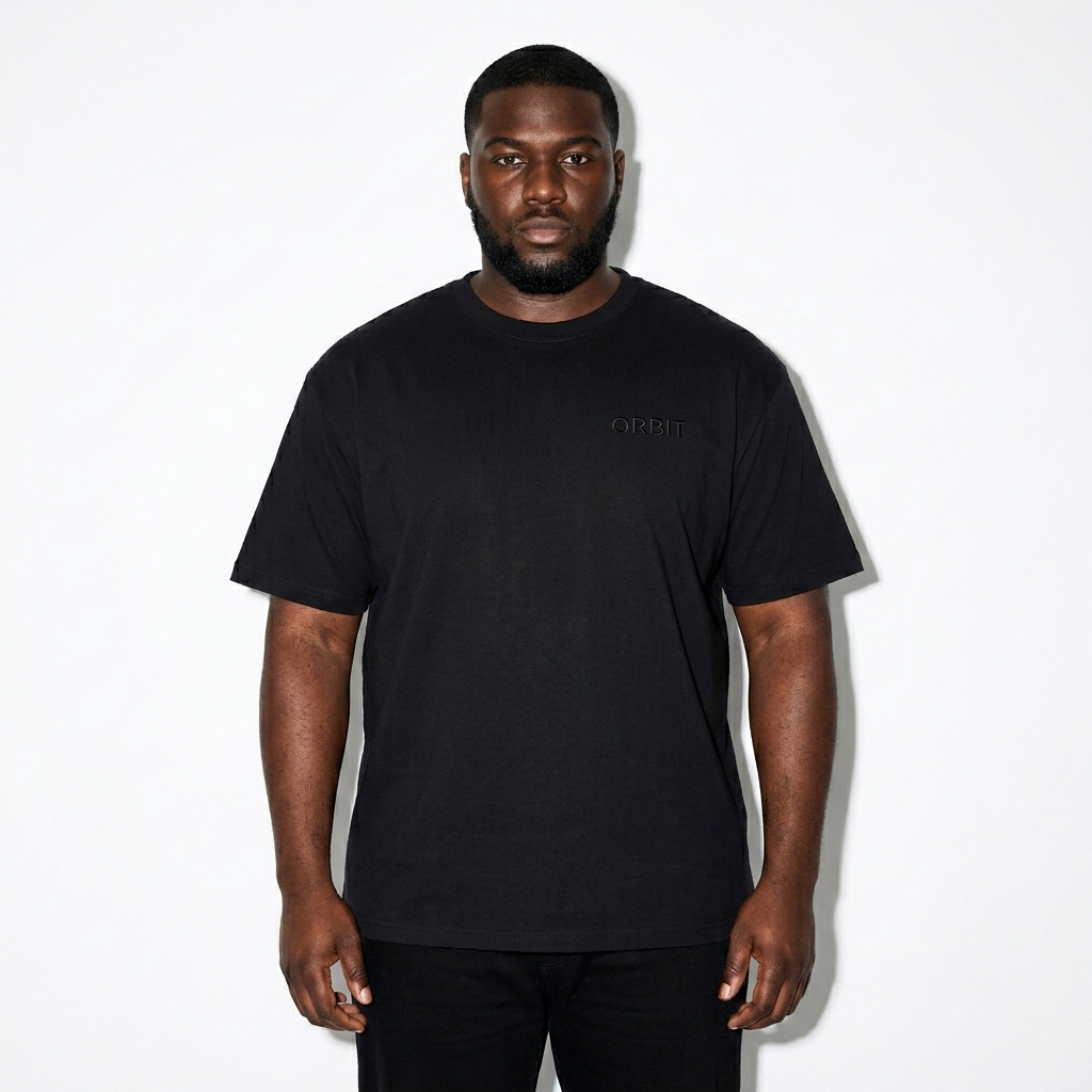 Men's Premium Short Sleeve Tee worn by a curvy Black male fashion influencer, clean-girl minimal styling, studio lookbook — custom men's premium short sleeve tee