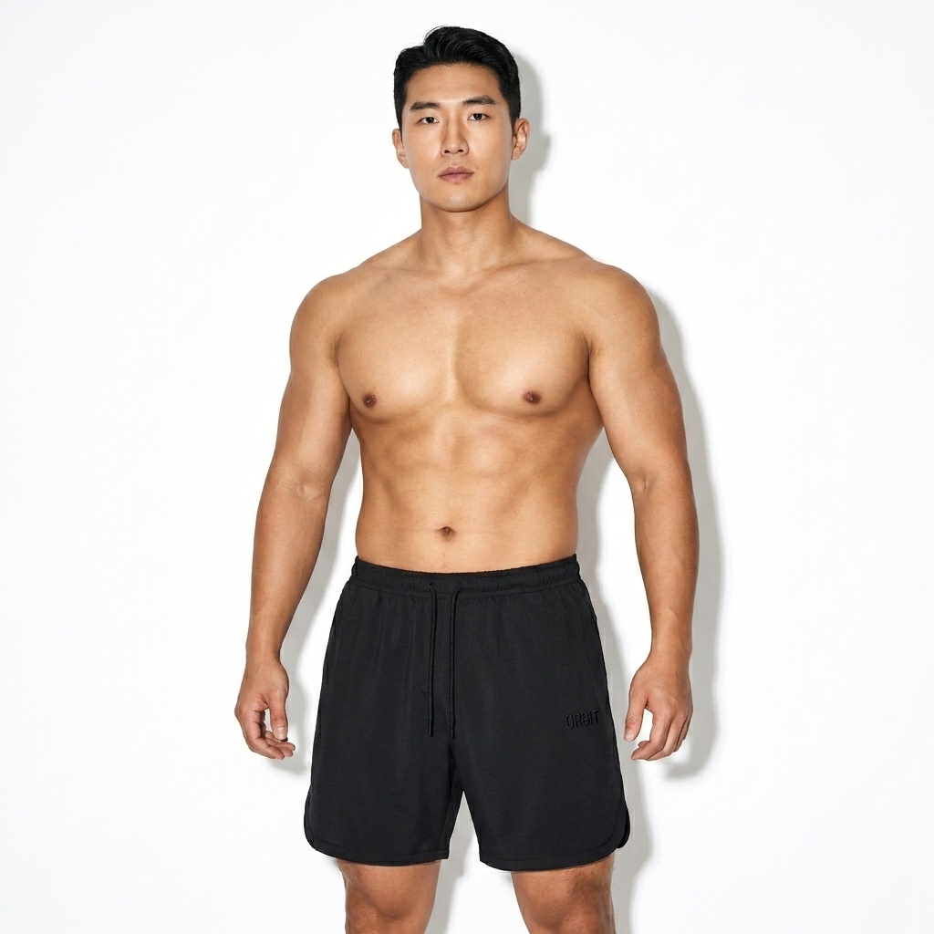 Mesh-Lined Performance Shorts worn by a broad-shouldered East Asian male fashion influencer, downtown streetwear styling, studio lookbook — custom mesh-lined performance shorts