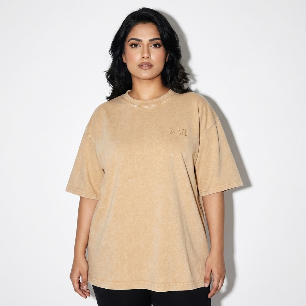 Mineral Wash Boxy T-Shirt worn by a mid-size Pakistani female fashion influencer, minimalist luxury styling, studio lookbook — custom mineral wash boxy t-shirt