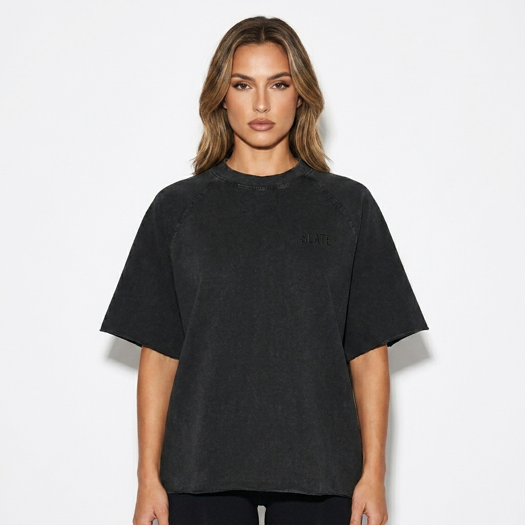 Unisex Mineral Wash Raw Edge T-Shirt worn by a toned German female fashion influencer, preppy ivy styling, studio lookbook — custom unisex mineral wash raw edge t-shirt