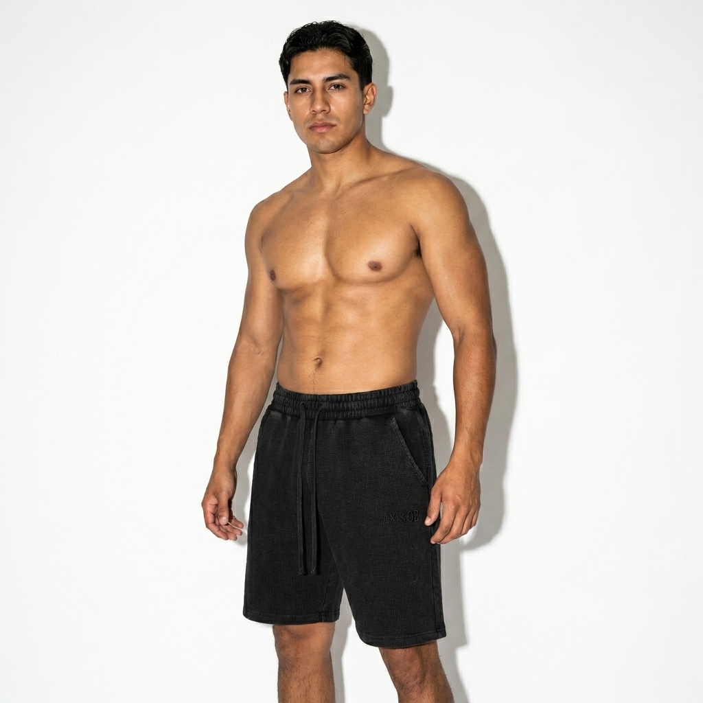 Mineral Wash Waffle Knit Shorts worn by a toned Mexican male fashion influencer, clean-girl minimal styling, studio lookbook — custom mineral wash waffle knit shorts