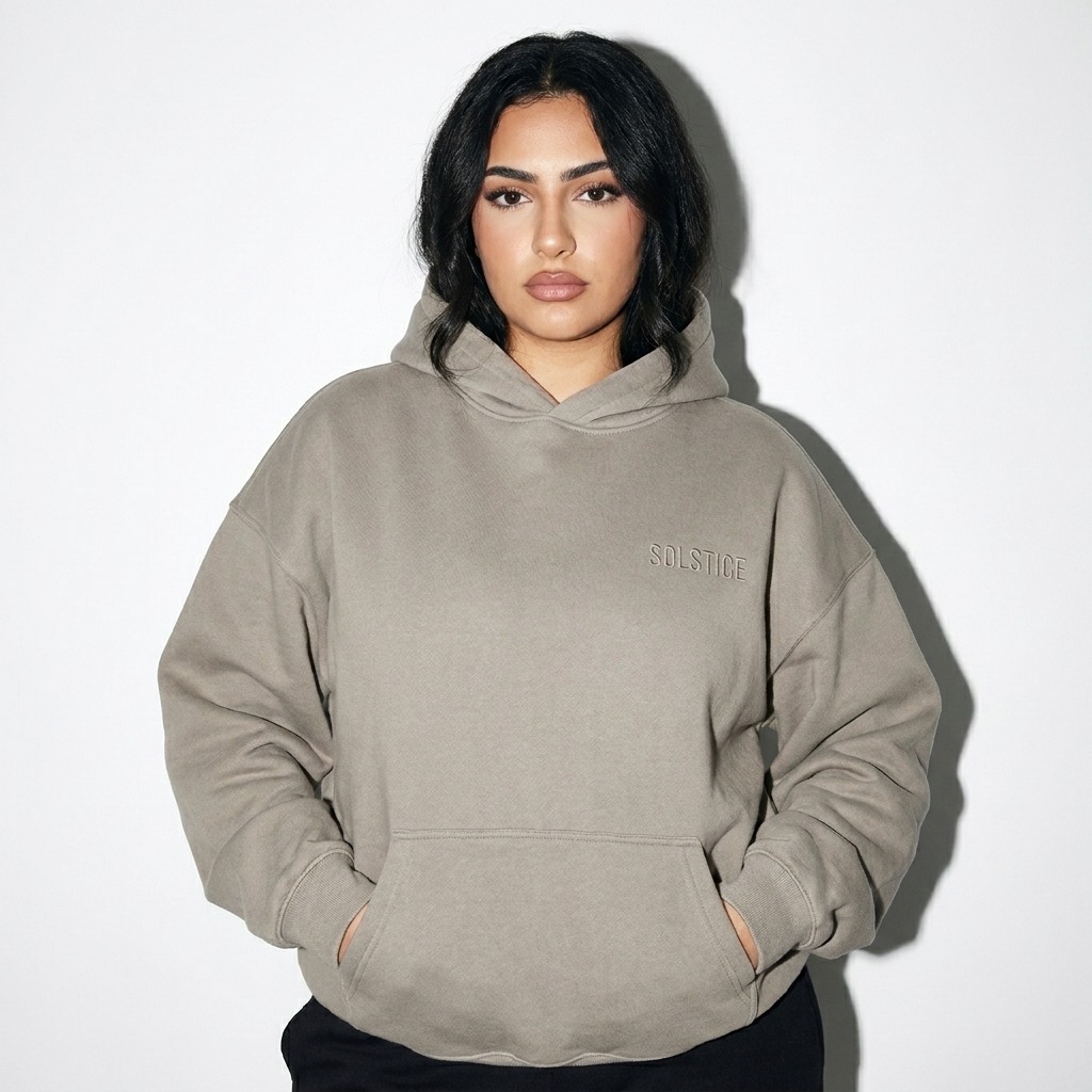 Oversize Fleeced Hoodie worn by a mid-size Arab female fashion influencer, sporty athleisure styling, studio lookbook — custom oversize fleeced hoodie