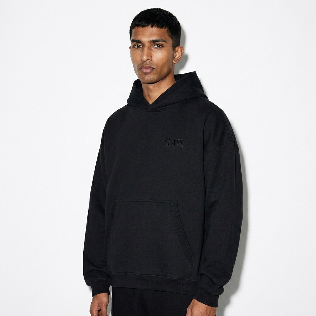 Oversized Boxy Fleece Hoodie worn by a lean South Asian male fashion influencer, minimalist luxury styling, studio lookbook — custom oversized boxy fleece hoodie