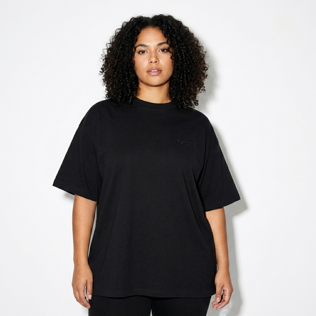 Oversized Cotton T-Shirt worn by a mid-size Hispanic female fashion influencer, editorial avant-garde styling, studio lookbook — custom oversized cotton t-shirt