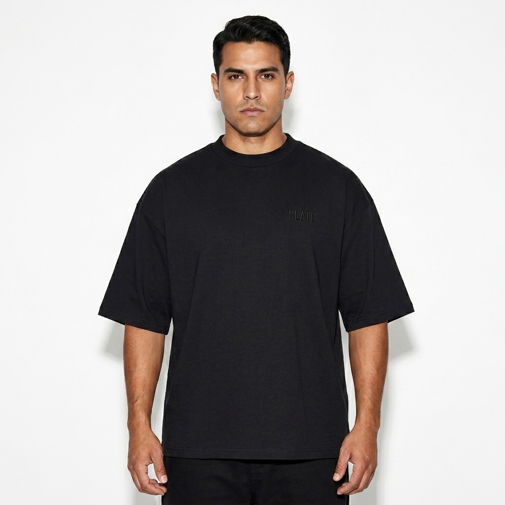 Oversized Drop Shoulder T-Shirt worn by a mid-size Hispanic male fashion influencer, downtown streetwear styling, studio lookbook — custom oversized drop shoulder t-shirt