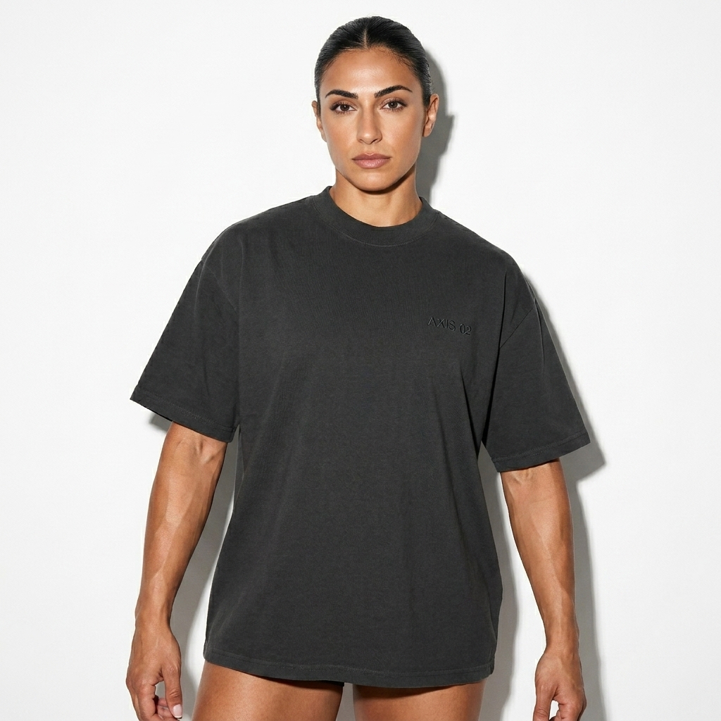 Oversized Faded T-Shirt worn by a athletic muscular Mediterranean female fashion influencer, downtown streetwear styling, studio lookbook — custom oversized faded t-shirt
