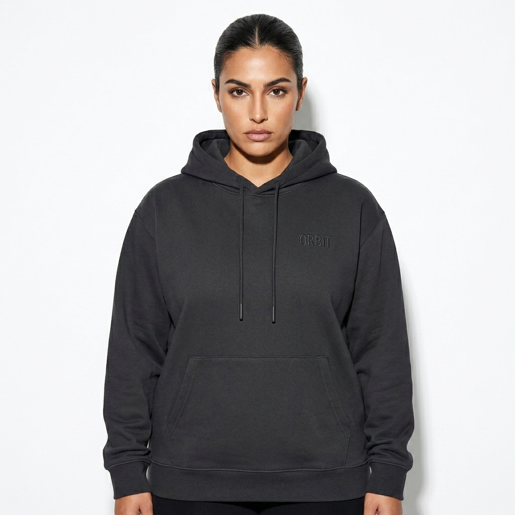 Oversized Heavyweight Hoodie worn by a broad-shouldered Mediterranean female fashion influencer, sporty athleisure styling, studio lookbook — custom oversized heavyweight hoodie