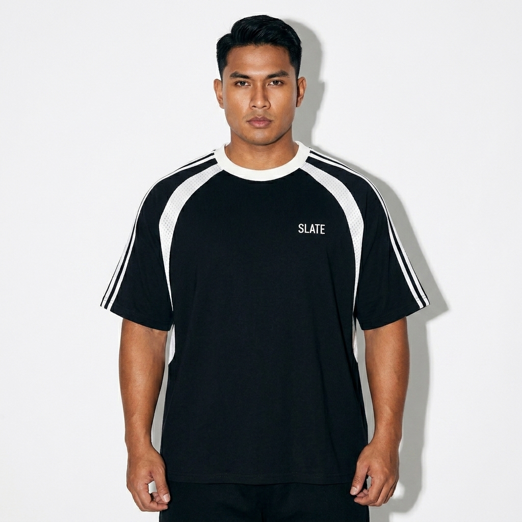 Oversized Mesh Panel T-Shirt worn by a broad-shouldered Southeast Asian male fashion influencer, workwear utility styling, studio lookbook — custom oversized mesh panel t-shirt