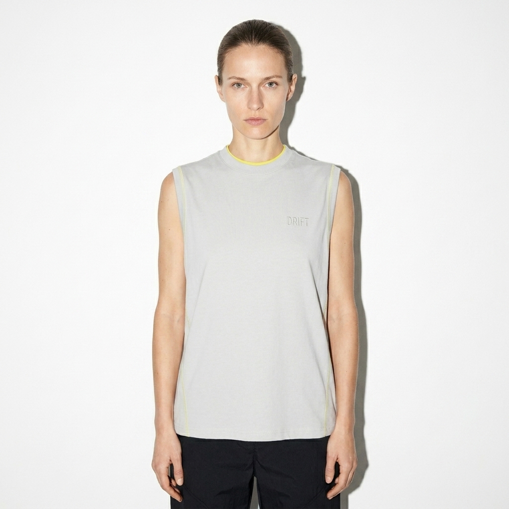 Performance Tank Top with Contrast Panels worn by a lean German female fashion influencer, sporty athleisure styling, studio lookbook — custom performance tank top with contrast panels