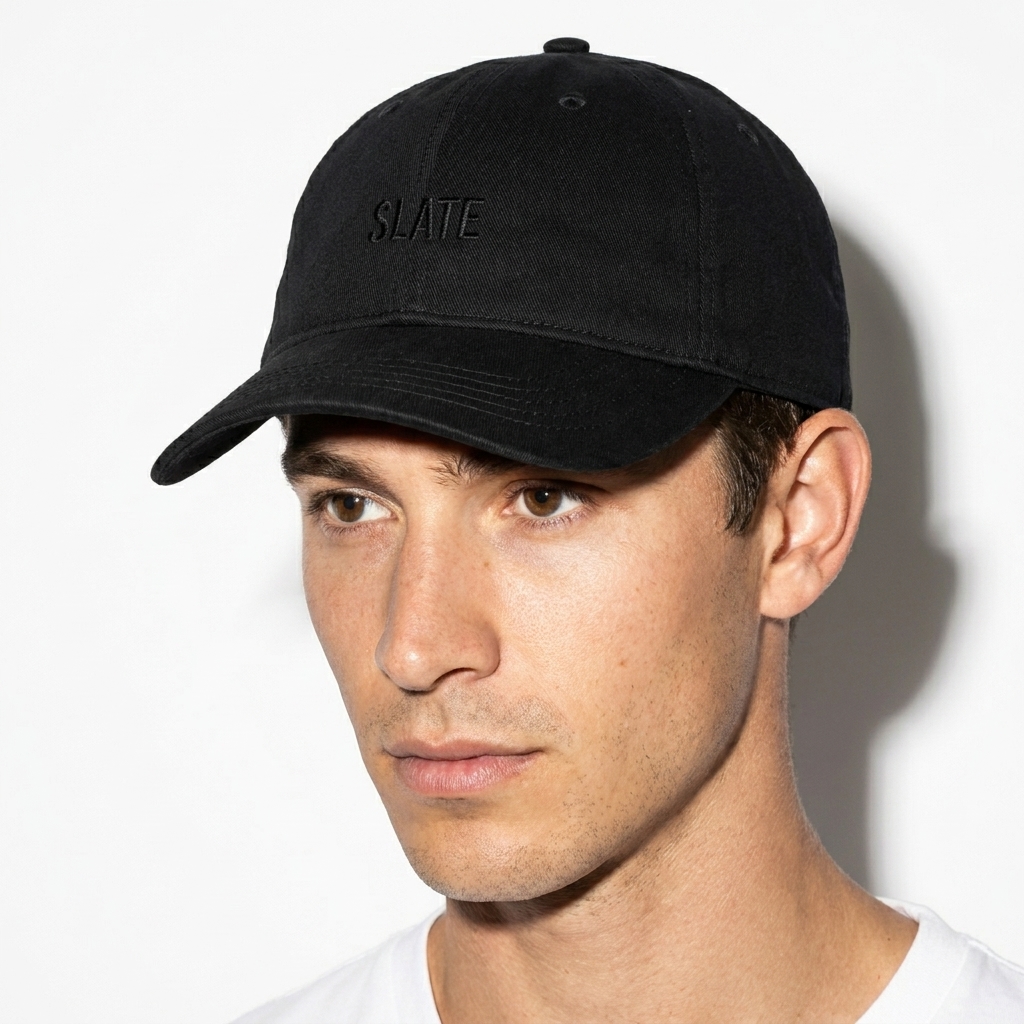 Pigment-Dyed Denim Cap worn by a mid-size Australian male fashion influencer, editorial avant-garde styling, studio lookbook — custom pigment-dyed denim cap