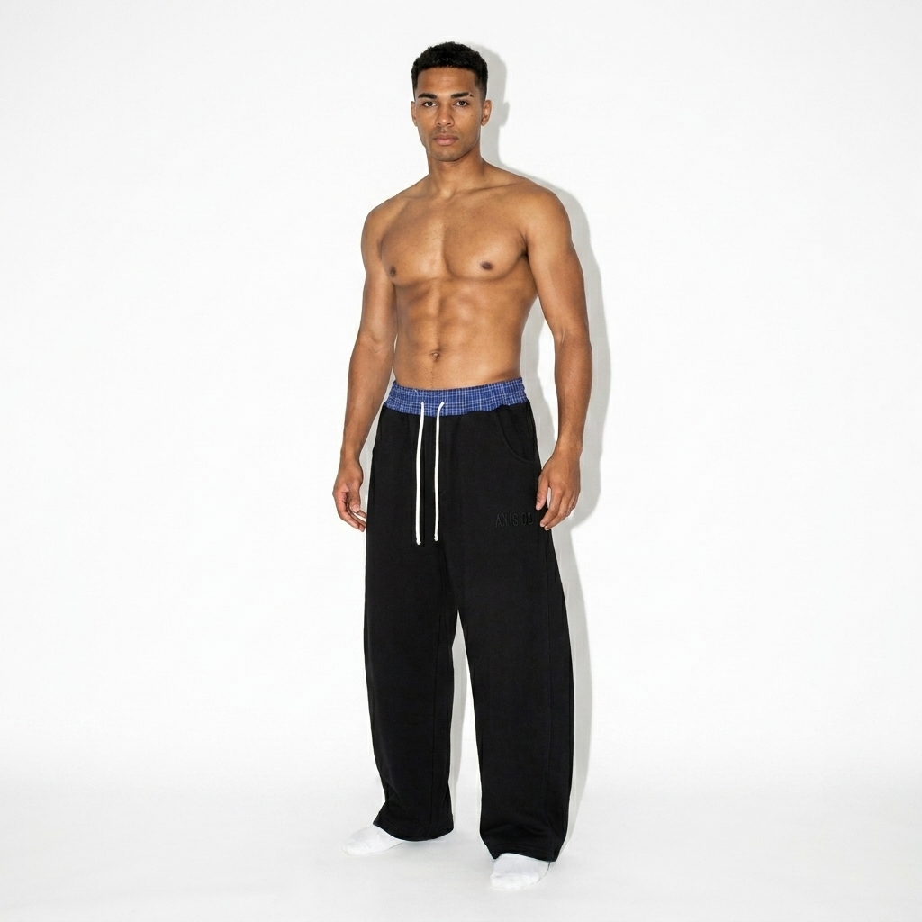 Plaid Waistband Barrel Sweatpants worn by a toned Mixed-race male fashion influencer, editorial avant-garde styling, studio lookbook — custom plaid waistband barrel sweatpants