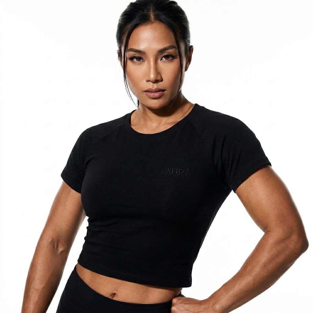 Raglan Sleeve Crop Top worn by a athletic muscular Vietnamese female fashion influencer, gorpcore outdoor styling, studio lookbook — custom raglan sleeve crop top