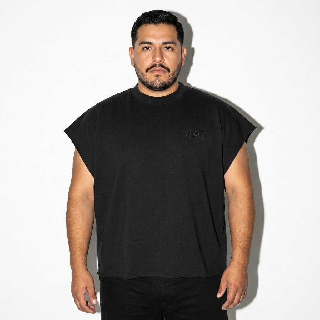 Raw Edge Boxy T-Shirt worn by a curvy Mexican male fashion influencer, techwear modern styling, studio lookbook — custom raw edge boxy t-shirt