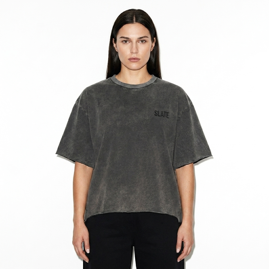 Raw Edge Snow Washed Boxy T-Shirt worn by a broad-shouldered Eastern European female fashion influencer, preppy ivy styling, studio lookbook — custom raw edge snow washed boxy t-shirt