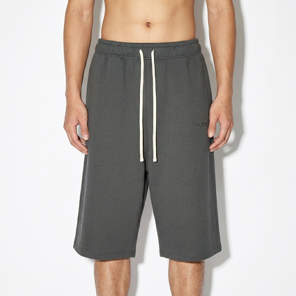 Relaxed Fit Drawstring Sweatshorts worn by a lean Vietnamese male fashion influencer, workwear utility styling, studio lookbook — custom relaxed fit drawstring sweatshorts