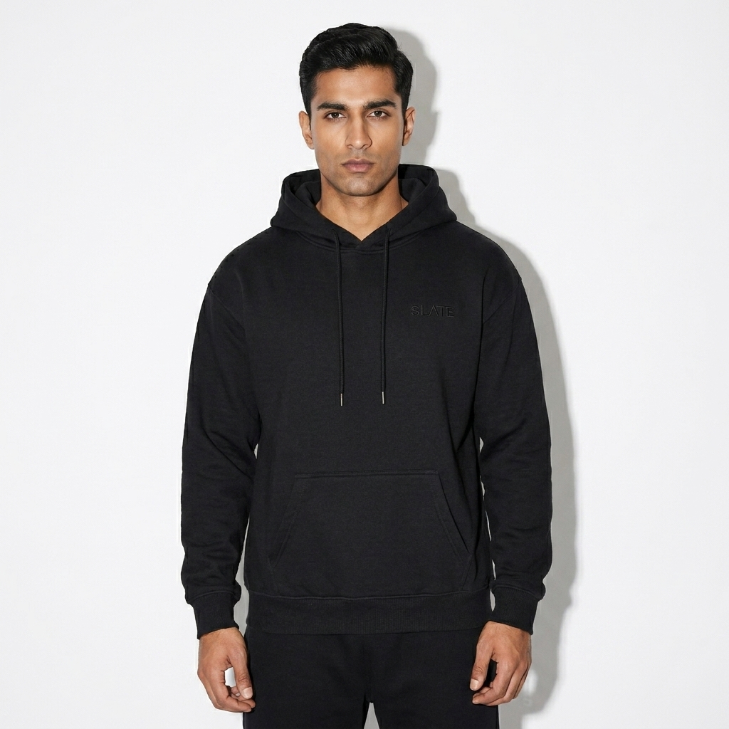 Relaxed Fit Pullover Hoodie worn by a toned Pakistani male fashion influencer, y2k revival styling, studio lookbook — custom relaxed fit pullover hoodie
