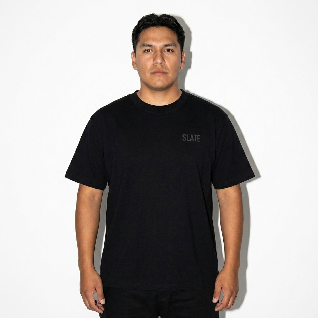 Relaxed Fit Seamless T-Shirt worn by a mid-size Indigenous American male fashion influencer, workwear utility styling, studio lookbook — custom relaxed fit seamless t-shirt