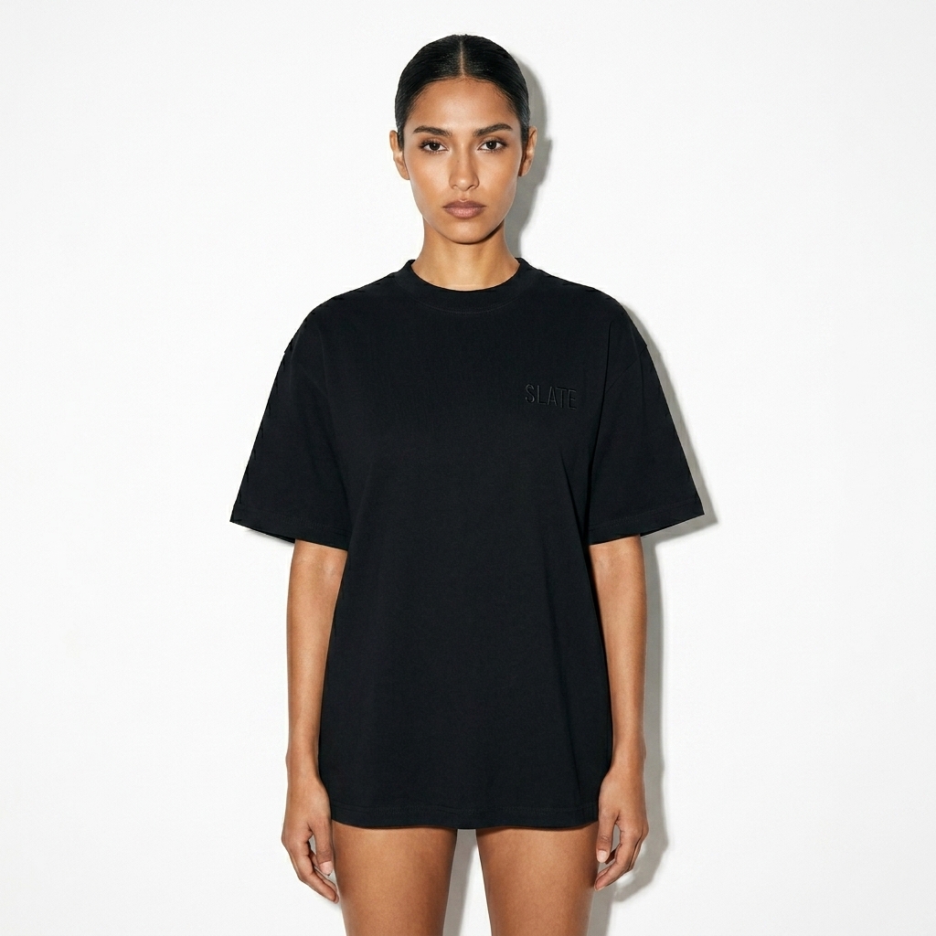 Reverse Dye Cotton T-Shirt worn by a slim tall Mexican female fashion influencer, minimalist luxury styling, studio lookbook — custom reverse dye cotton t-shirt