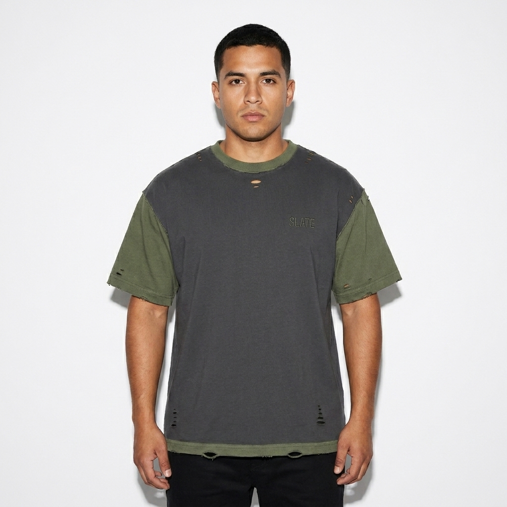 Reversible Hand-Frayed T-Shirt worn by a mid-size Hispanic male fashion influencer, gorpcore outdoor styling, studio lookbook — custom reversible hand-frayed t-shirt