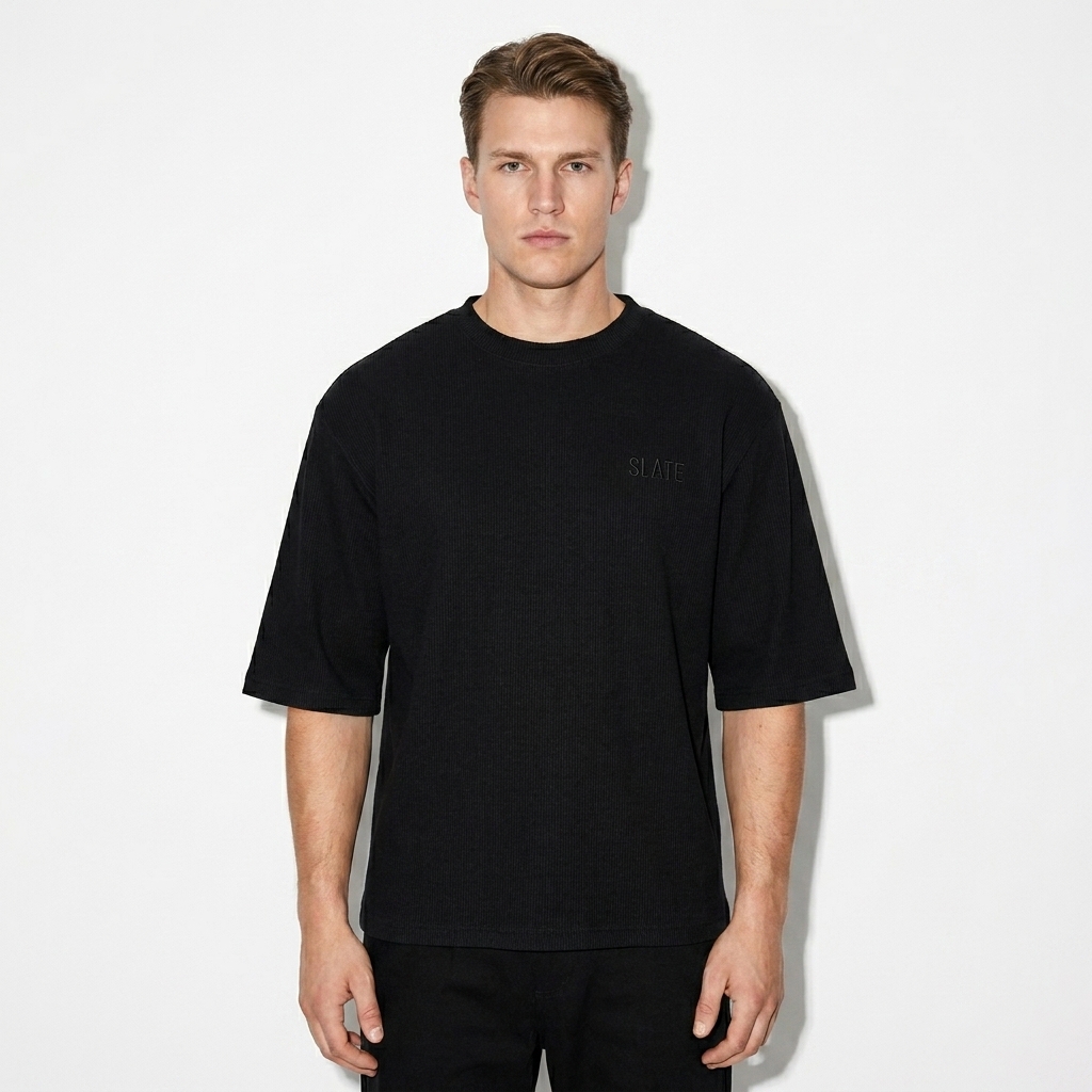 Ribbed Half-Sleeve T-Shirt worn by a broad-shouldered Scandinavian male fashion influencer, techwear modern styling, studio lookbook — custom ribbed half-sleeve t-shirt