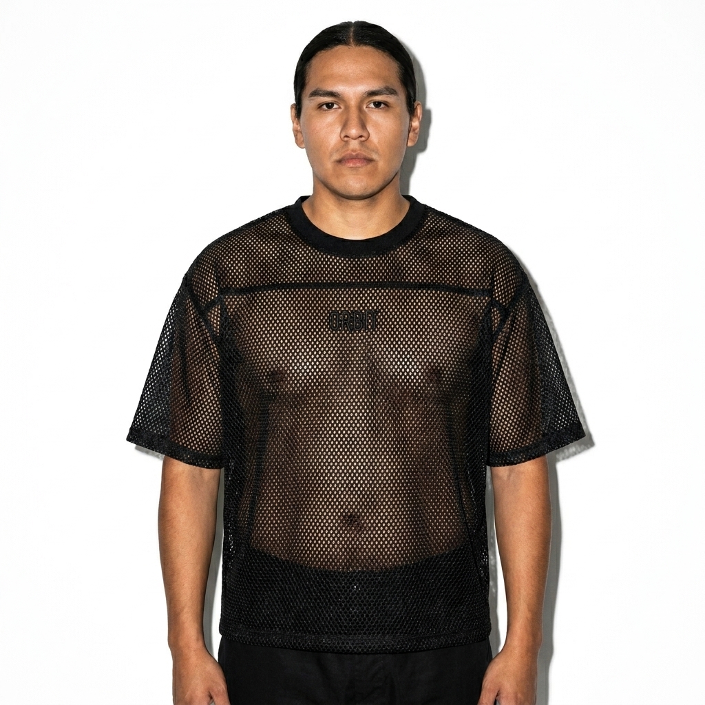 See-through Boxy Net T-Shirt worn by a mid-size Indigenous American male fashion influencer, downtown streetwear styling, studio lookbook — custom see-through boxy net t-shirt