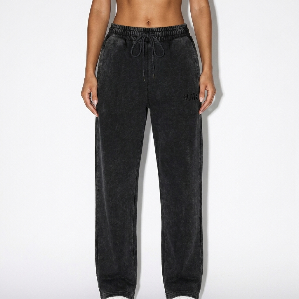 Snow Wash Heavyweight Sweatpants worn by a toned Mediterranean female fashion influencer, workwear utility styling, studio lookbook — custom snow wash heavyweight sweatpants