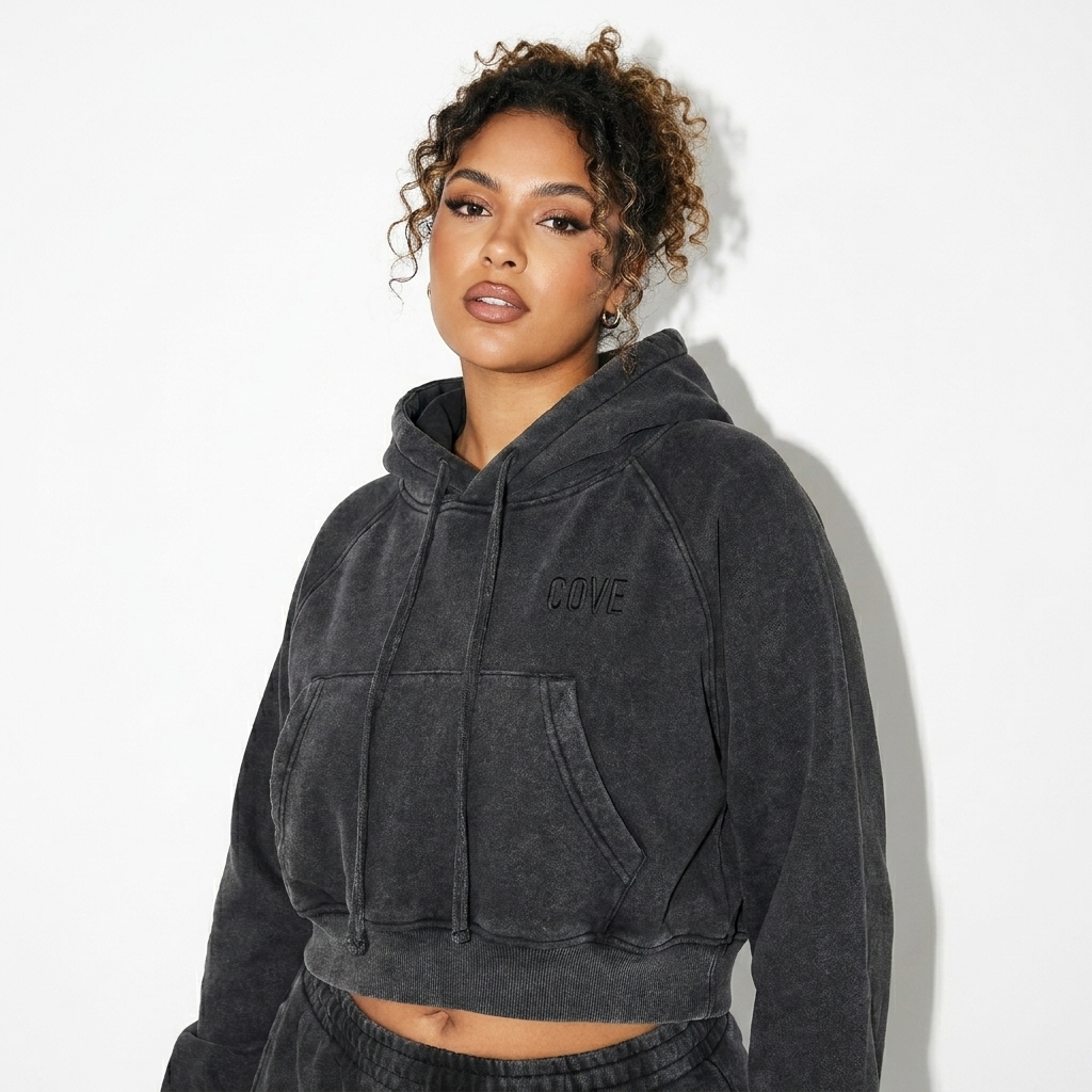 Snow Washed Cropped Hoodie worn by a curvy North African female fashion influencer, techwear modern styling, studio lookbook — custom snow washed cropped hoodie