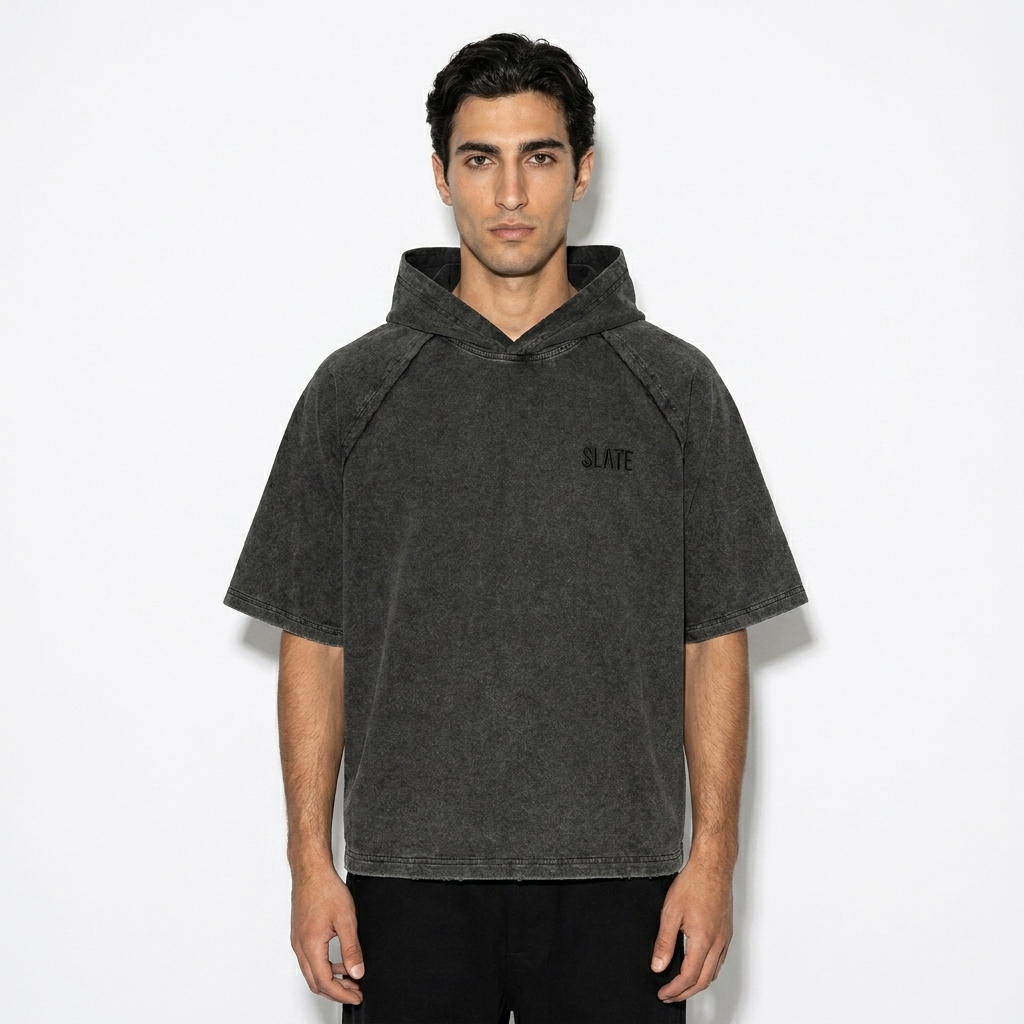 Snow Washed Hooded T-Shirt worn by a slim tall Mediterranean male fashion influencer, gorpcore outdoor styling, studio lookbook — custom snow washed hooded t-shirt