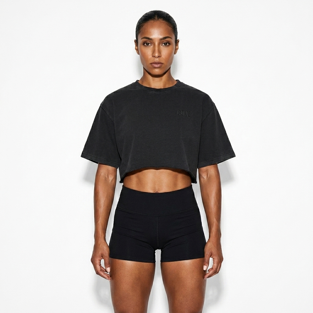 Snow Washed Raw Edge Crop Top worn by a athletic muscular North African female fashion influencer, workwear utility styling, studio lookbook — custom snow washed raw edge crop top