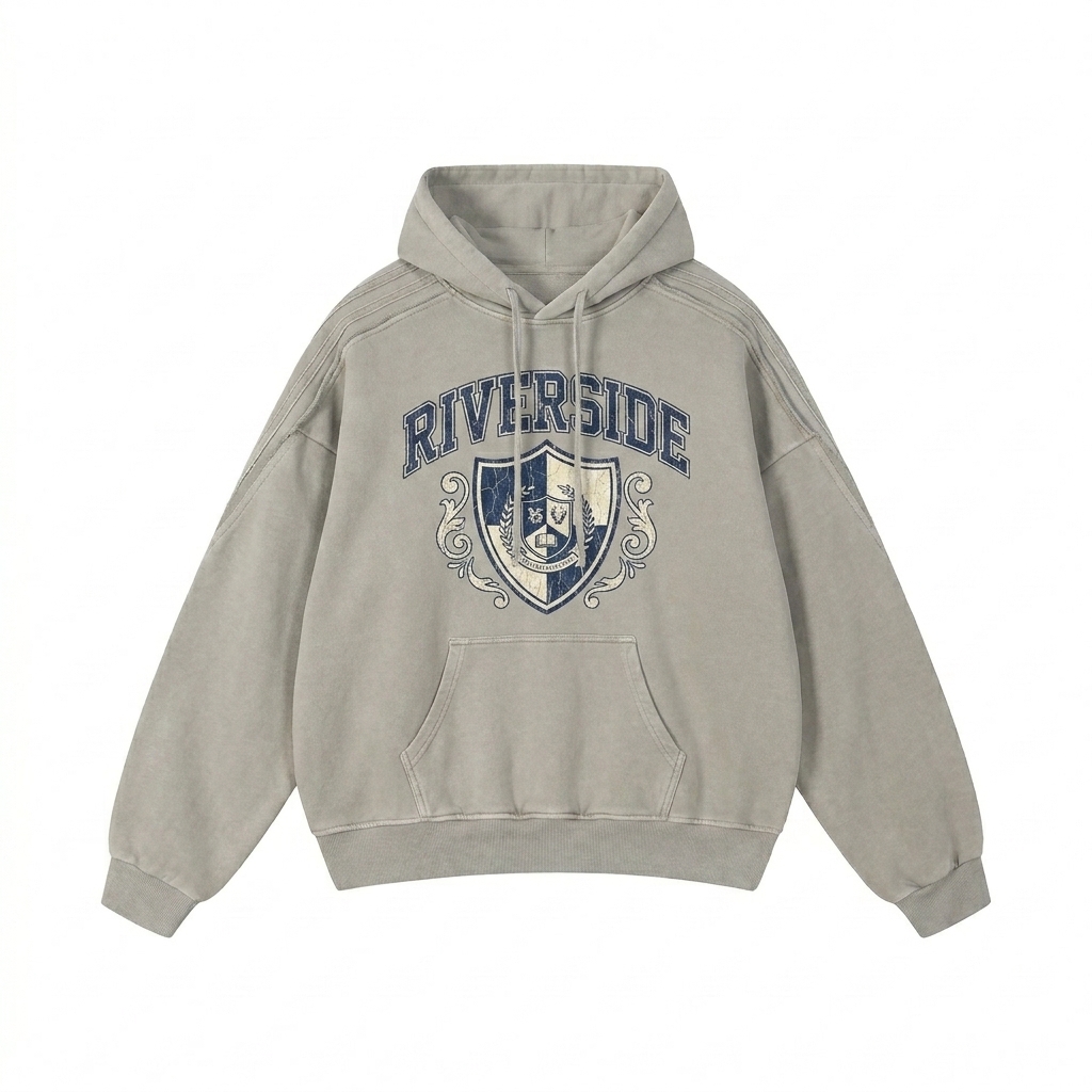 Custom Snow Washed Raw Edge Hoodie design direction 3: Retro Collegiate Emblem featuring the RIVERSIDE wordmark